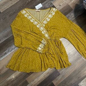 Embroidered Peplum Top